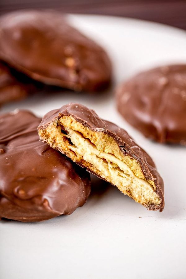 a plate of shortbread cookies covered with peanut butter, and dipped in chocolate. 