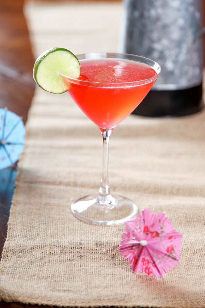 a Raspberry Daiquiri drink garnished with a slice of lime. 