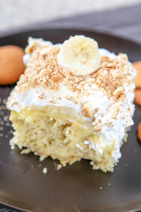 cake filled with banana pudding and topped with cool whip and crushed vanilla wafers. 