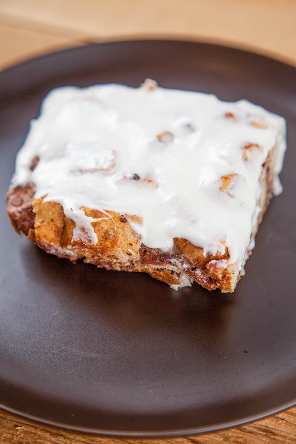 baked cinnamon french toast casserole topped with cream cheese icing.