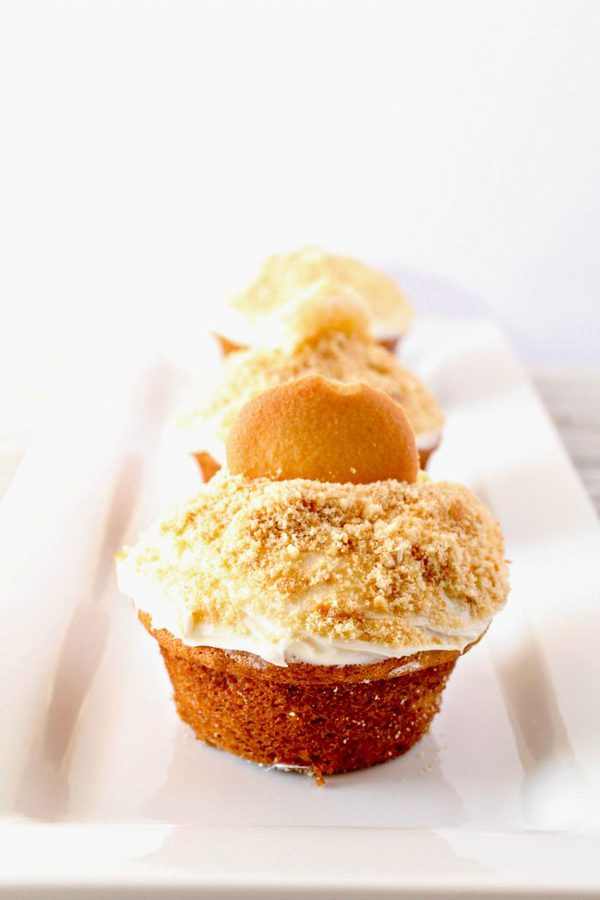 banana cupcakes topped with vanilla buttercream and crumbled vanilla wafer cookies.