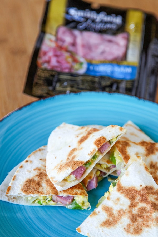 a ham, cheese, and egg quesadilla cut into triangles.