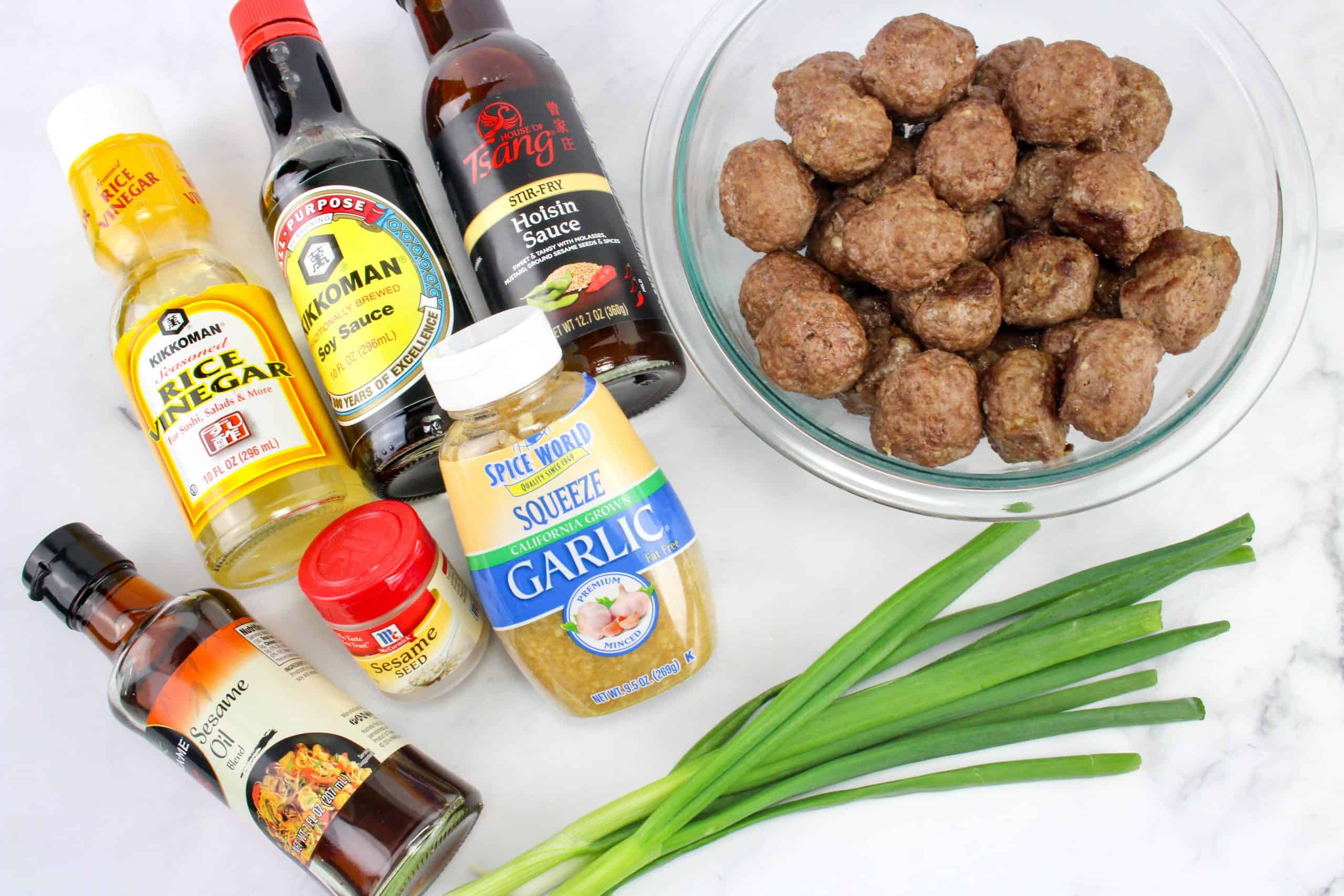 ingredients including meatballs, rice vinegar, soy sauce, hoisin sauce, sesame oil, garlic, sesame seeds, and green onions.