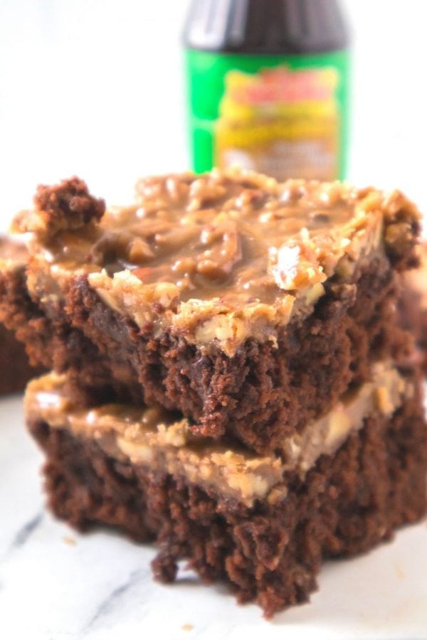 chocolate brownies topped with praline frosting and pecans.