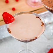 an overhead view of a chocolate martini garnished with a single strawberry.