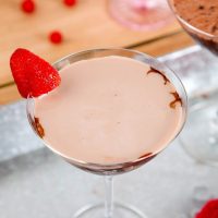 an overhead view of a chocolate martini garnished with a single strawberry.