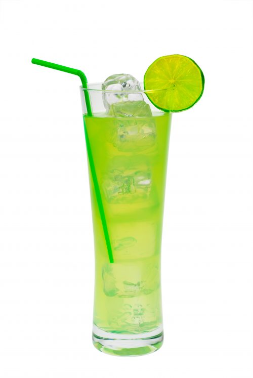 a yellow green mountain dew cocktail garnished with a lime wedge and a green plastic straw.