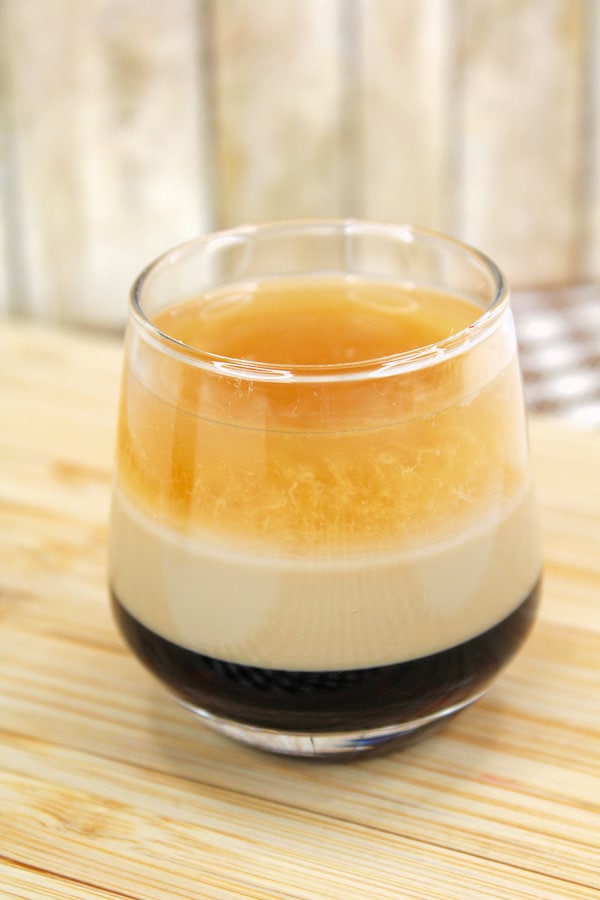 a three layered duck fart shot in a clear glass.