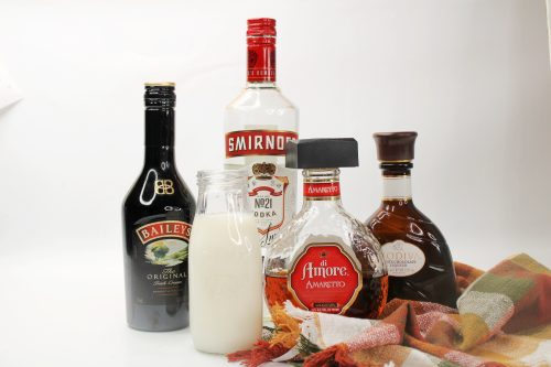 baileys, smirnoff, amarettto, and godiva liqueur on a white background.