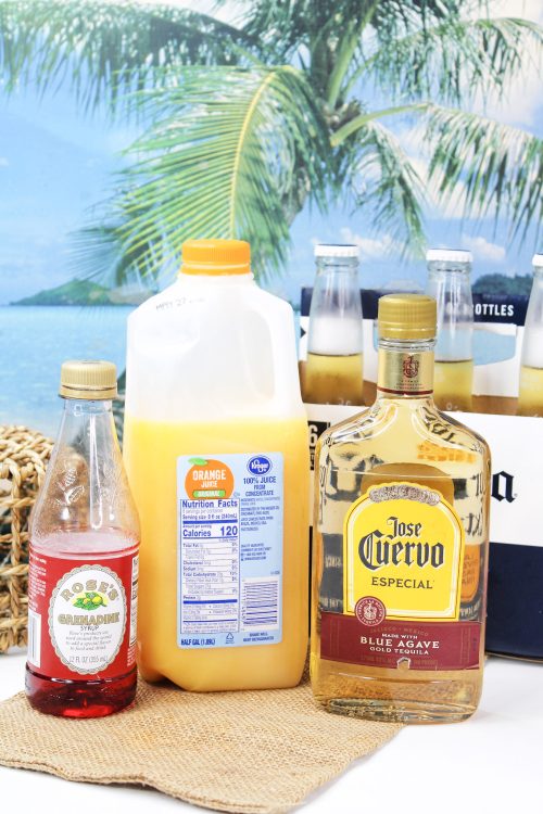 jose cuervo tequila, orange juice, grenadine, and beer on a beach background.