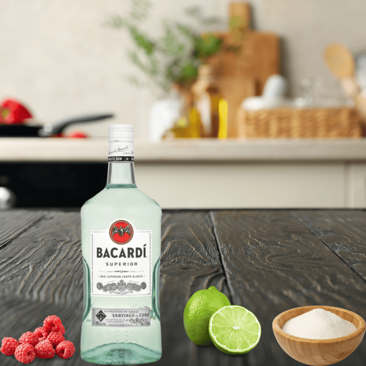 rum, sugar, raspberries, and a lime on a wooden countertop.