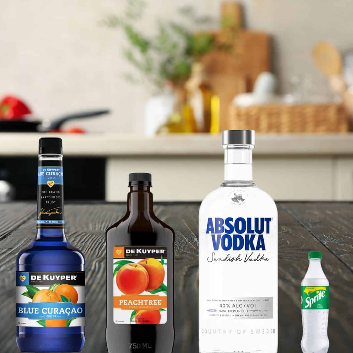 blue curacao, peach schnapps, absolut vodka, and sprite on a counter. 