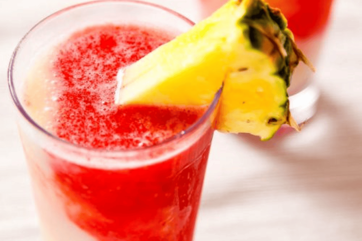 Layered frozen cocktail with strawberry and piña colada flavors.