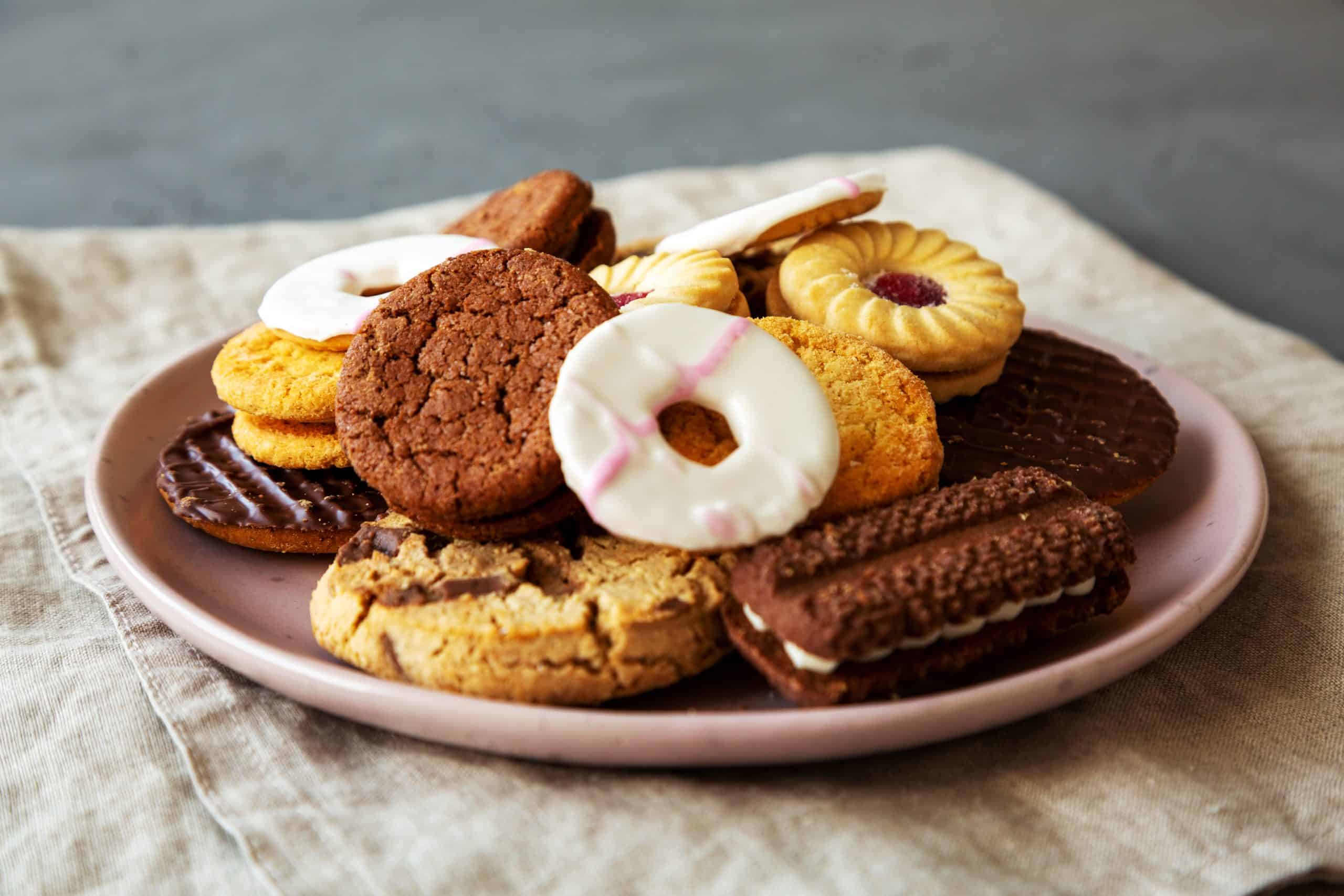 Variety of Biscuits on a pink Plate, side view. Close-up.