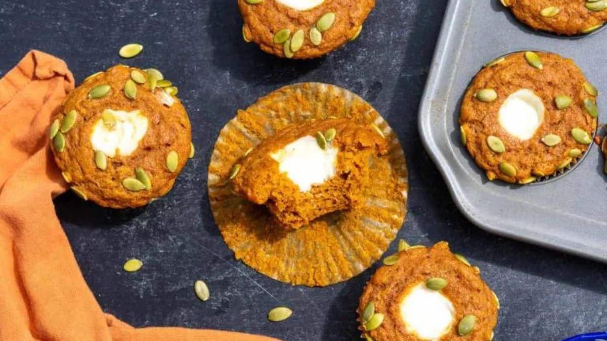 Muffins with pumpkin batter and cream cheese filling.