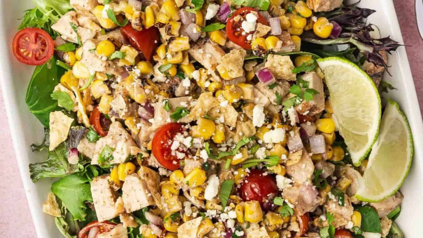 Top-down view of Mexican Street Corn Chicken Salad with grilled chicken, corn, and creamy dressing.