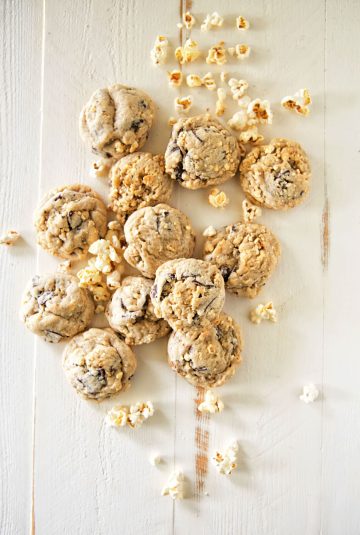 Classic chocolate chip cookies topped with salty-sweet kettle corn, offering a delightful treat for lovers of both flavors.