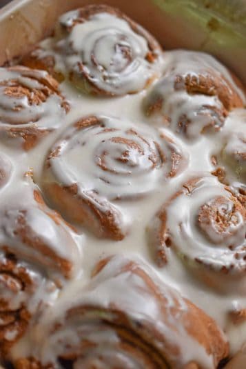 The glaze is poured onto the Bisquick cinnamon rolls.