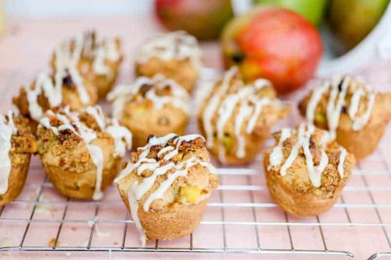Mango Muffins with Maple Walnut Streusel on a rack.