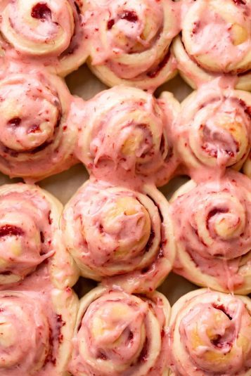 Strawberry rolls on parchment paper.
