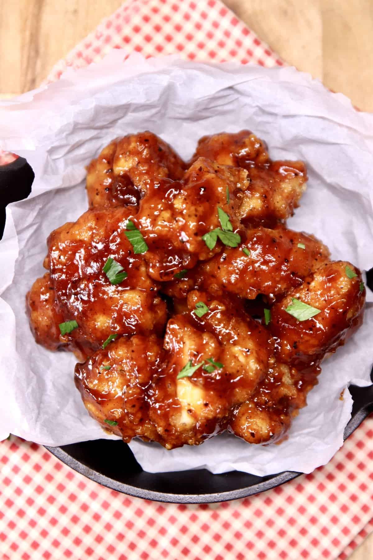 Overhead view of bowl of bbq boneless wings.