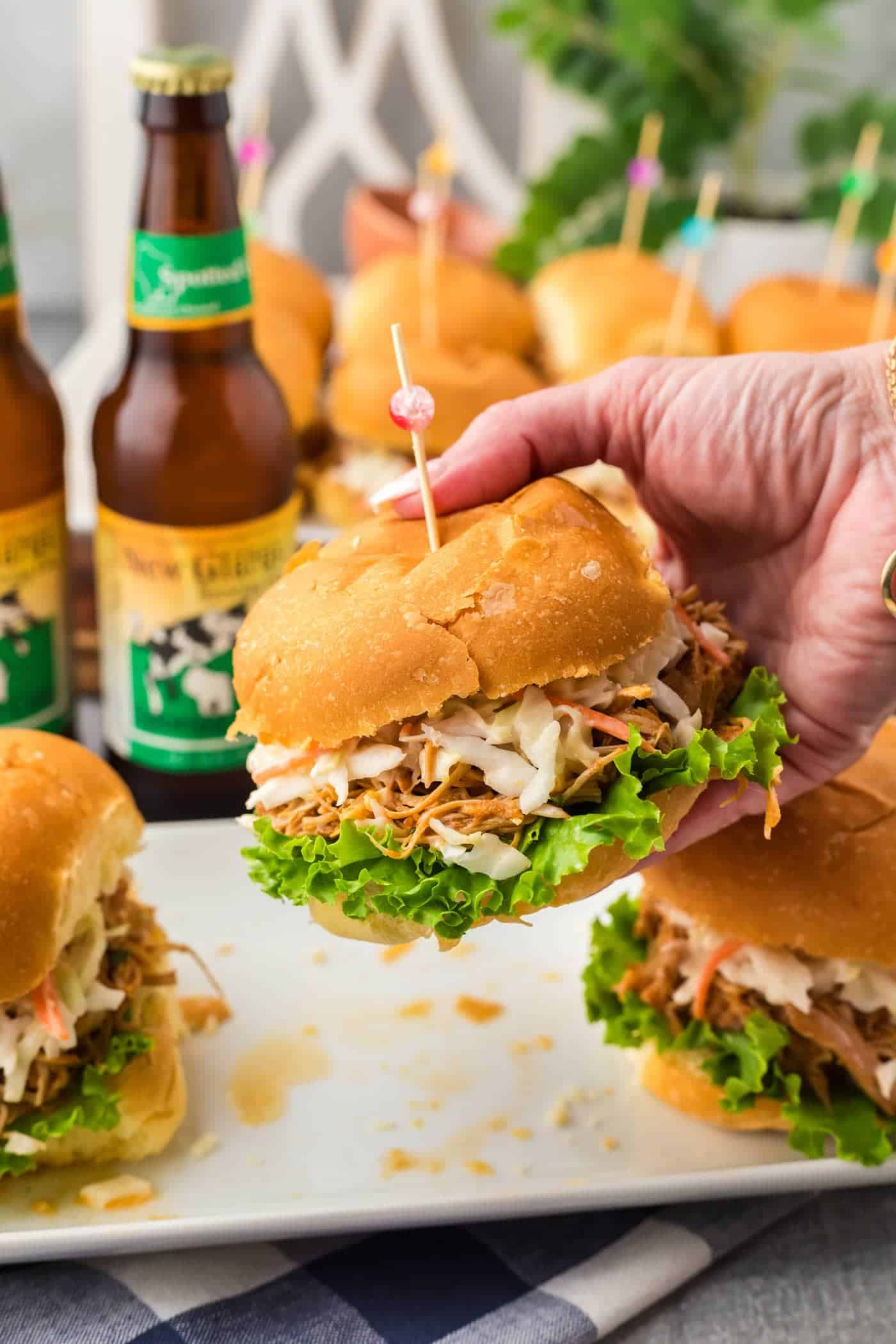 Hand holding up a BBQ Chicken Sandwich.