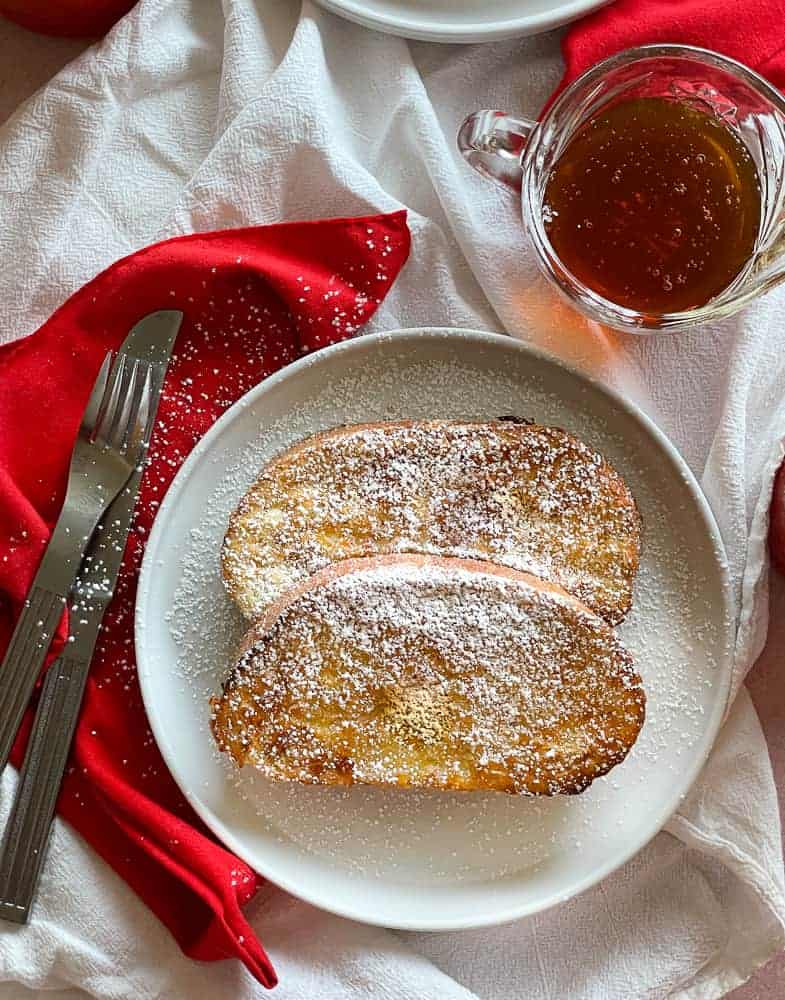 Ranch baked chicken next to a rocket salad.