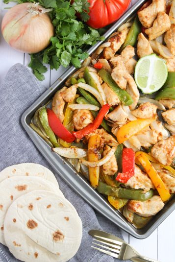 Tortillas served with chicken, vegetables, and onion slices.