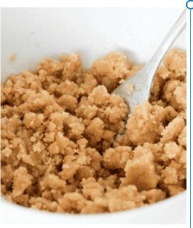 a fork mixing up brown sugar streusel. 