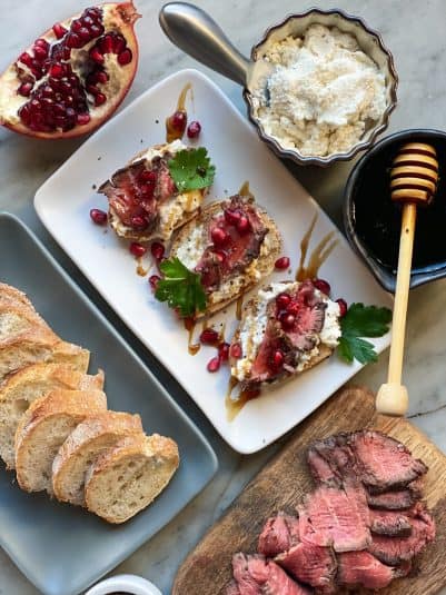 A display of Steak Crostinis With Horseradish Ricotta.