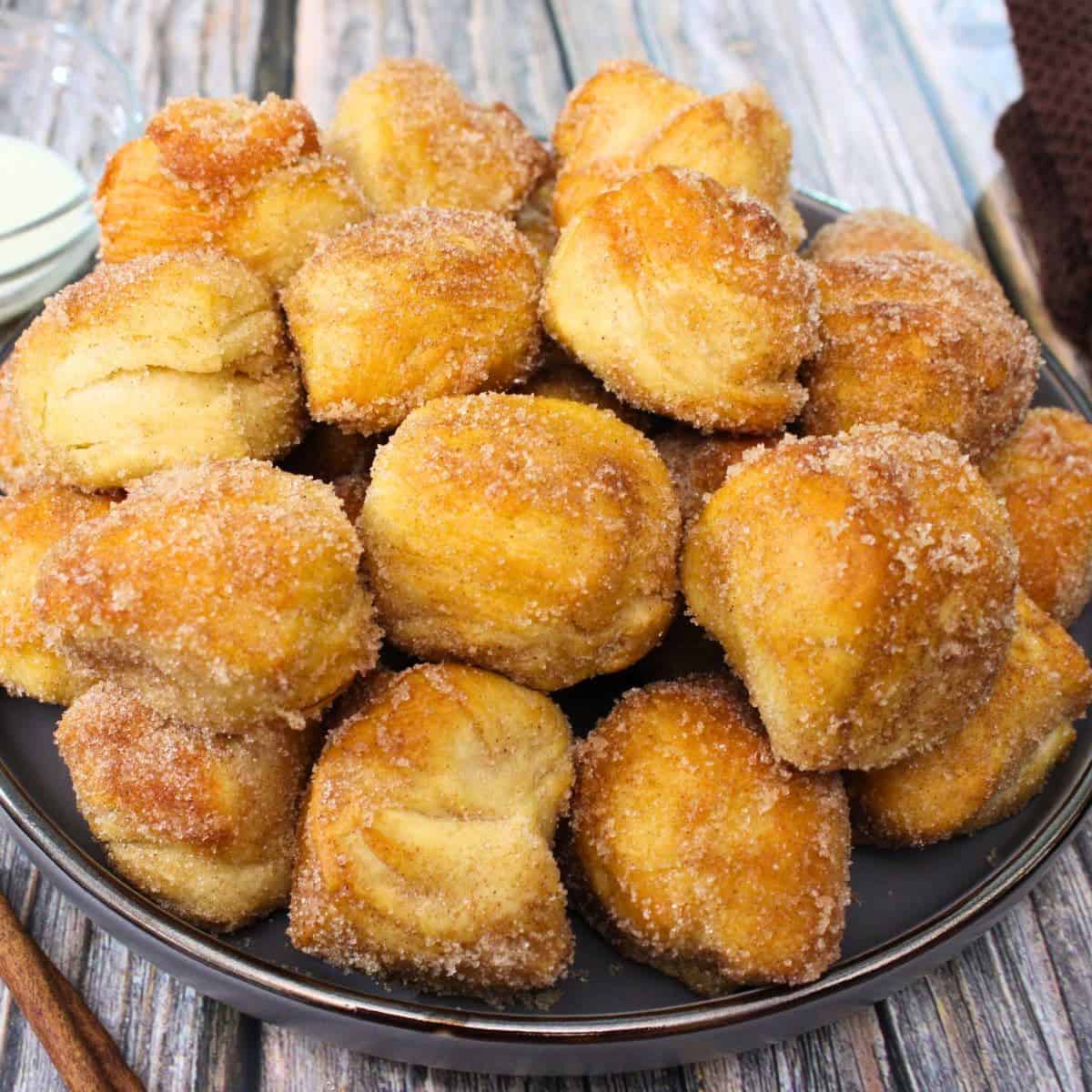 Air fryer cinnamon roll bites with canned biscuits recipe dinners done quick featured image.