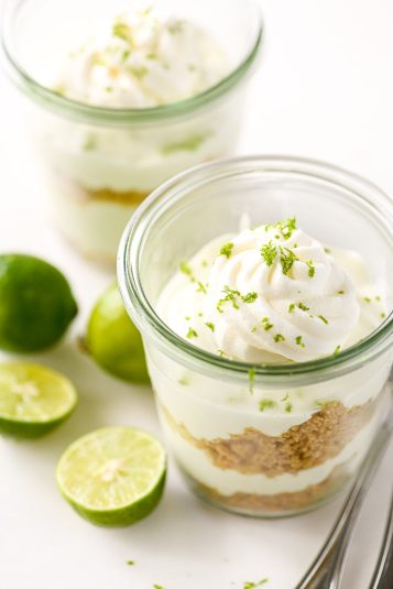 Key lime parfait in a small jar with key limes.