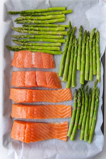 Sheet Pan Salmon Asparagus on a parchment paper lined sheet pan.
