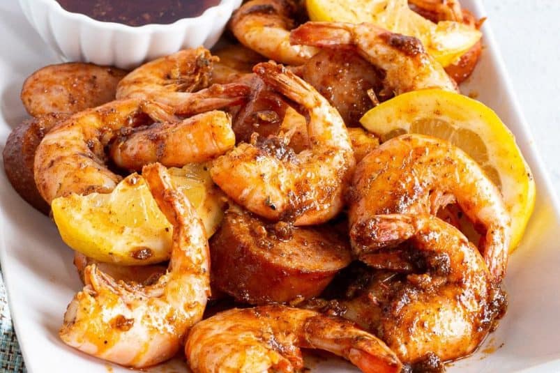 Cajun smothered chicken served with rice and vegetables.