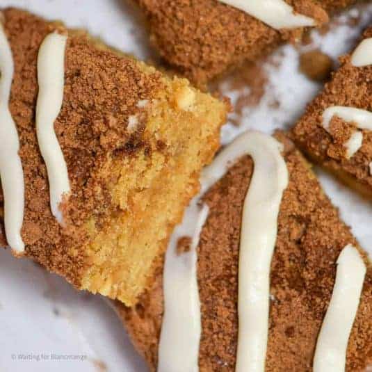 Overhead image of cinnamon sugar blondies with cream cheese frosting piped over the top.