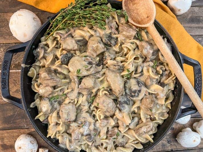 One Pot Beef Stroganoff in the dutch oven garnished with more fresh thyme.