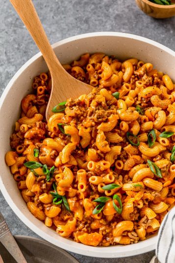 Cheeseburger pasta overhead shot in a white bowl.