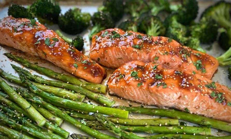 A display of Sheet Pan Salmon with Asparagus.