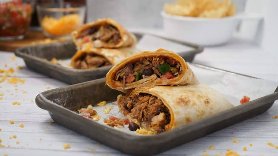 Cheesy Pulled Pork Burritos on Silver Platters.