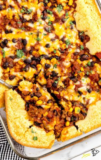 Close up overhead shot of a baking dish full of Cornbread Chili Casserole.