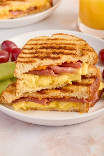 Prosciutto and Egg Panini on a white plate.