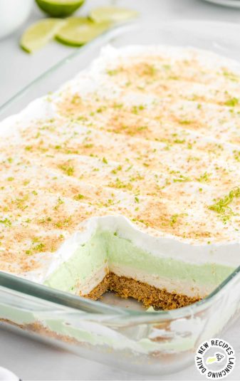 Graham crackers and lime zest sprinkled on top of the pie in a baking dish.