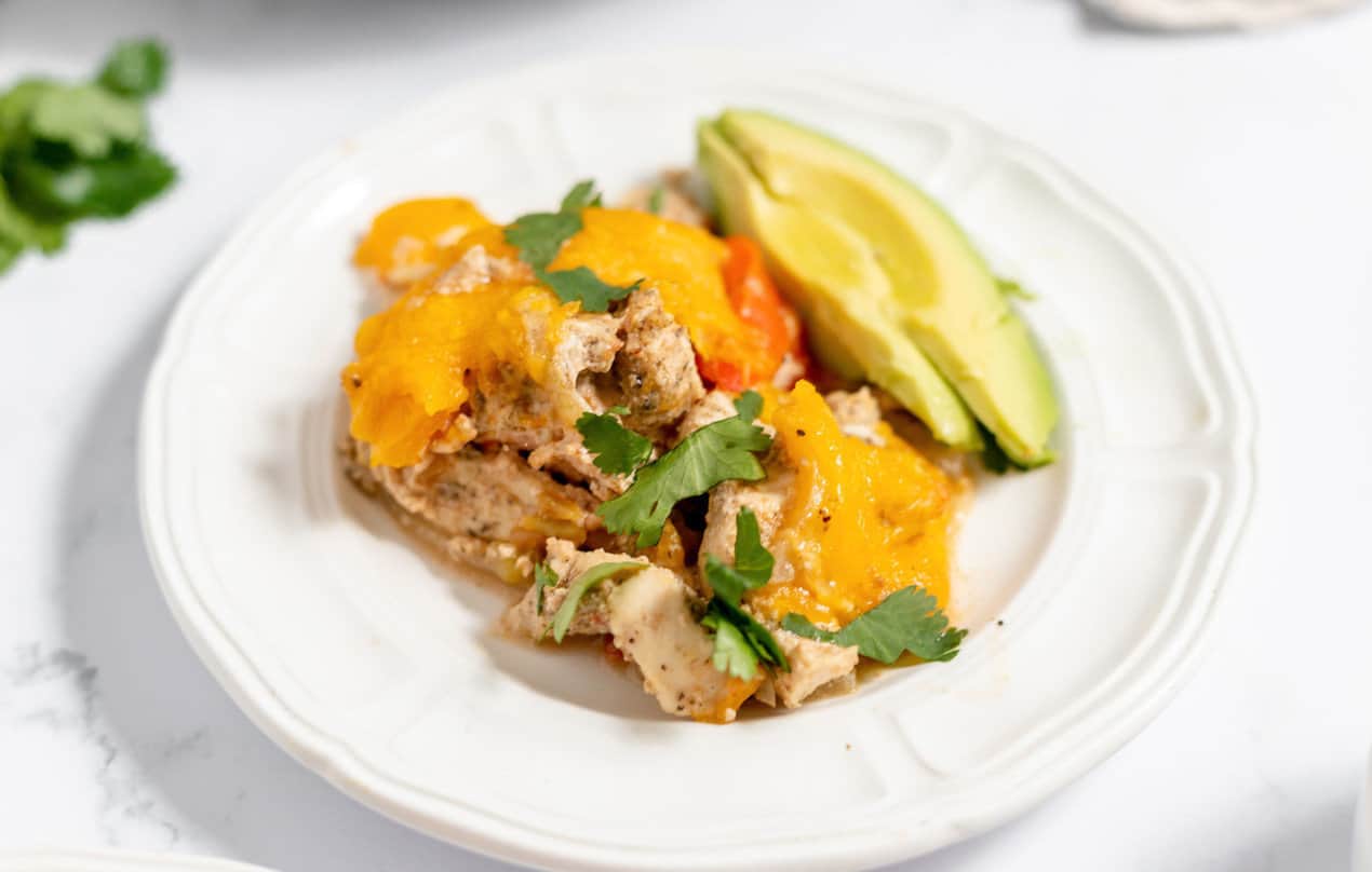 A baking dish full of stuffed chicken breasts.