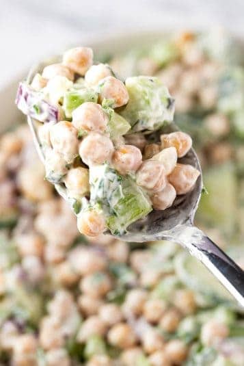 An up close view of a spoonful of Creamy Chickpea Salad.