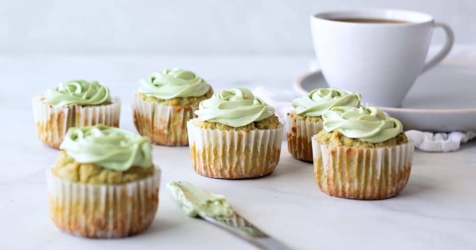 Feature matcha cupcakes coffee cup frosting on knife.