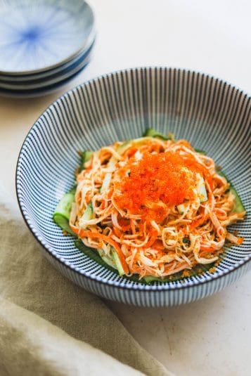 Spicy Kani Salad with tobiko and panko bread crumbs in a blue Japanese striped bowl.