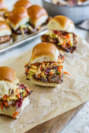 Karaage chicken sliders (Japanese fried chicken) with napa cabbage-radicchio coleslaw and spicy kewpie mayo on Hawaiian rolls.
