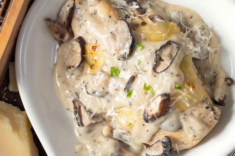 Portobello mushrooms and chicken cooked in a savory sauce.