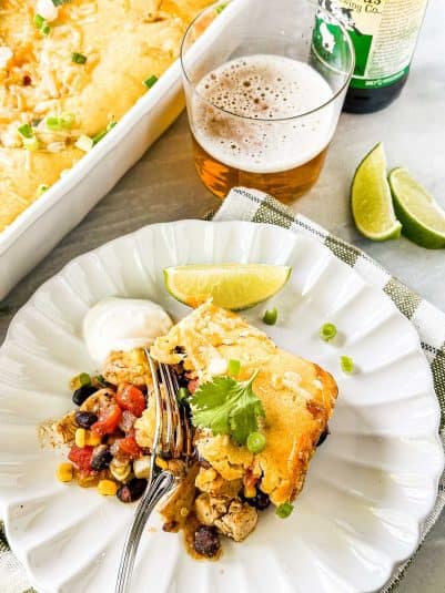A serving of Mexican Cornbread Casserole on a white plate.