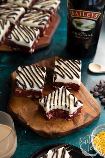 Bailey's Red Velvet Blondies on a wooden board.
